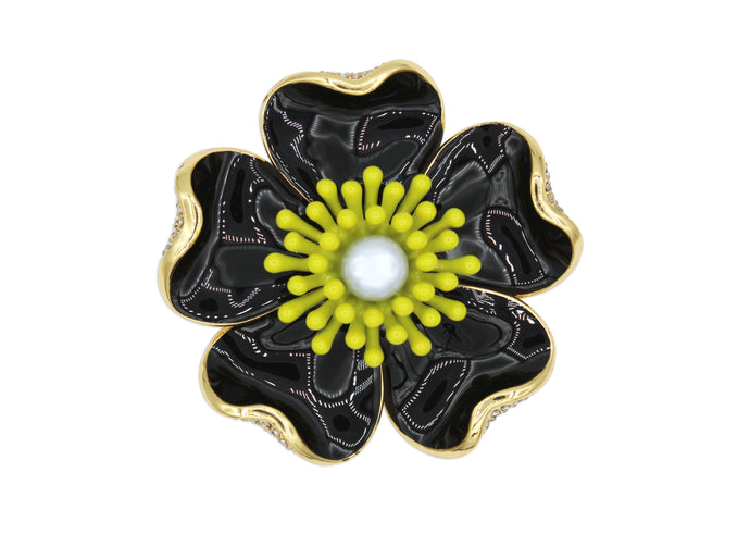 Anemone black brooch with yellow contrast center, pearl detail and gold accents. 